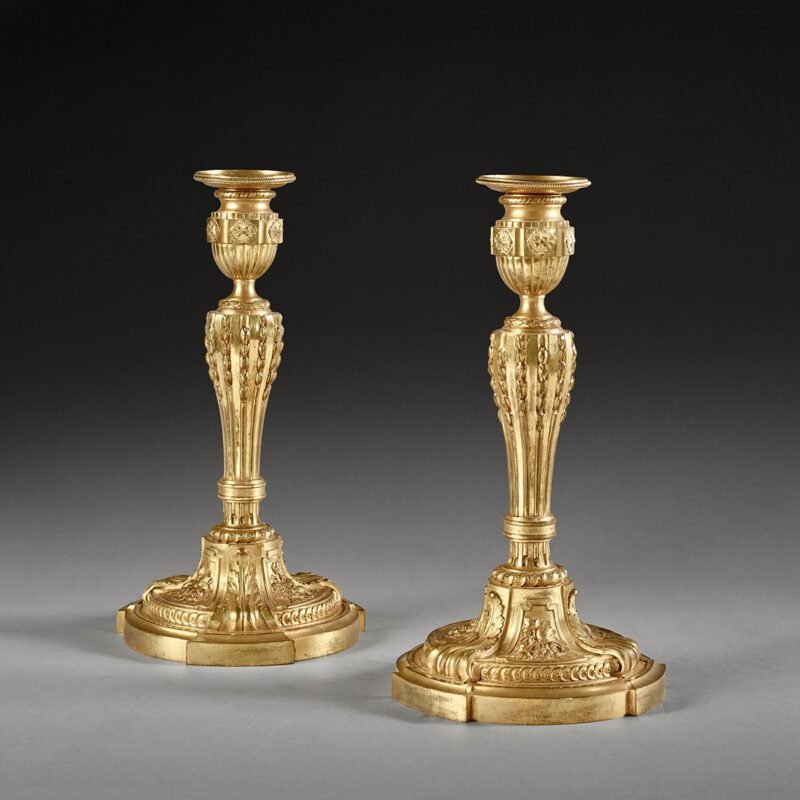 A fine pair of Louis XVI ormolu candlesticks