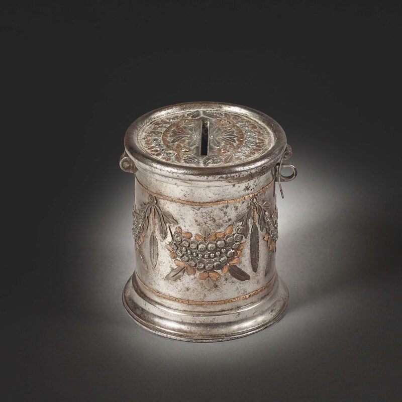 Polished steel moneybox, chased and gilt bronze, enhanced with brass and pewter